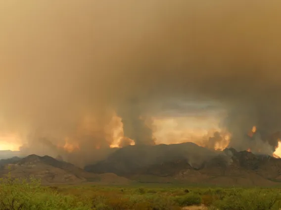 Mountain seen covered by smoke from a distance