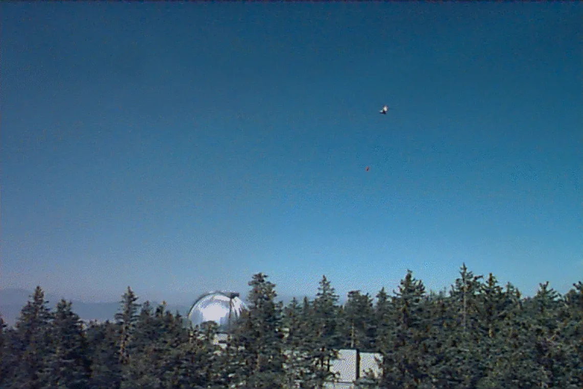 Helicopter flying above Clark Peak